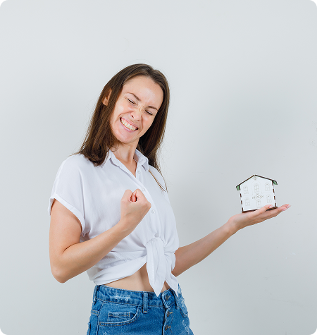 Happy woman holding piggy bank